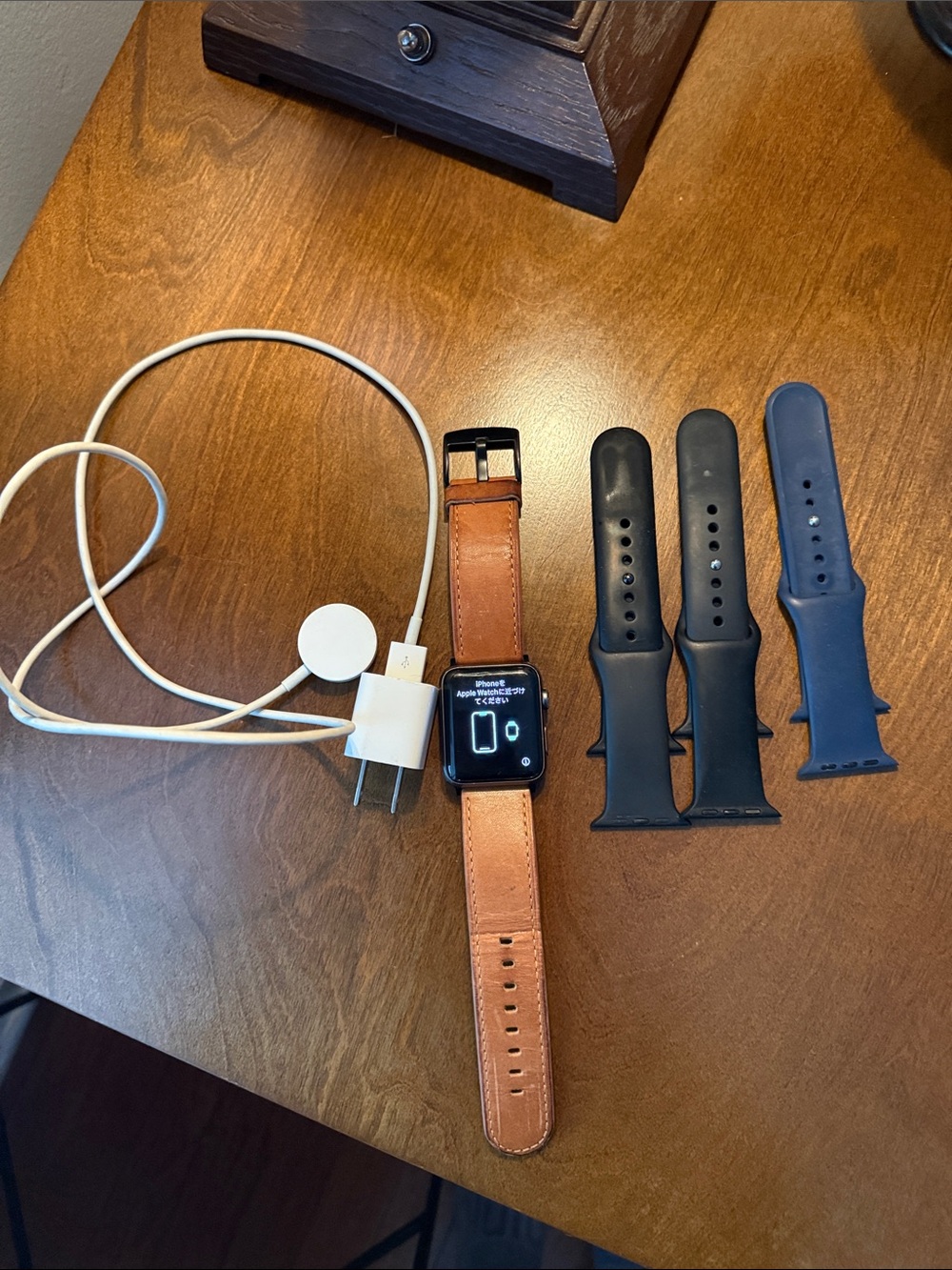 Apple Smartwatch with Tan Leather Band and Black & Navy Silicone Bands